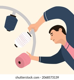 A man at a factory changing a reel of thread. vector flat illustration in a modern style and pastel colors