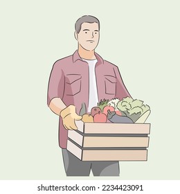 Hombre agricultor que contiene frutas de verduras de la granja después de la cosecha
