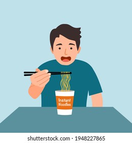 Man feel hungry and eating instant noodles for lunch. Asian noodle cup easy cheap meal.