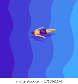Man floating in the sea. Top view