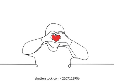 man folded hands in heart shape raising them to level of face - one line drawing vector. Korean gesture "I love you" or "Saranhae" 