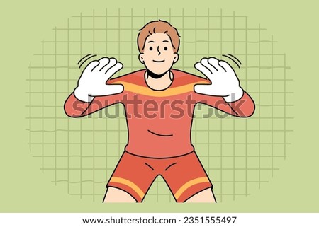 Man football goalkeeper of getting ready to take kick from players from opposing team. Guy is professional football player participating in premier league or prestigious olympic tournament