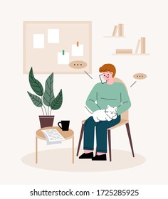 Man freelancer. Man holding a cat, talking on the phone. Telecommuting at home.