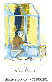 man in a french cafe