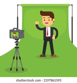 A man in front of camera recording a video to share it in internet