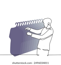 man in front of a rack with t-shirts choosing - one line art vector. concept male buyer in a clothing store. Handmade vector not AI