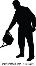 man in garden with can