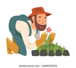 Man Gardener Planting and Admiring Flower, Cheerful Male Farmer Character in veralls Working at Garden or Farm Vector Illustration
