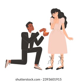 A man gets down on one knee and proposes to a woman