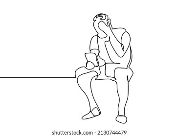 a man gets shocked and upset when he gets bad news online while sitting at home