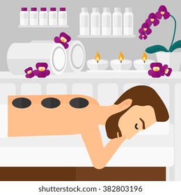 Man getting stone therapy.