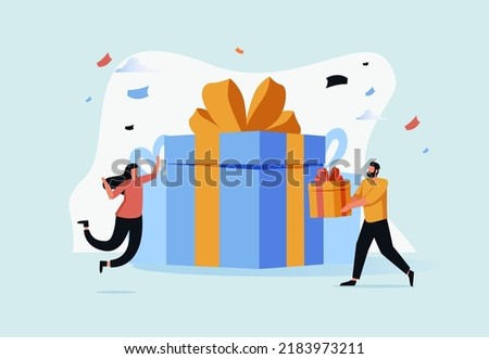 A man gives a gift to his beloved woman. A man holds a box with a gift. A woman is happy to see a box with a gift. The couple boyfriend let a gift his girlfriend she is jumping in cheerful moment.