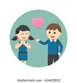 a man giving shape balloon to girl