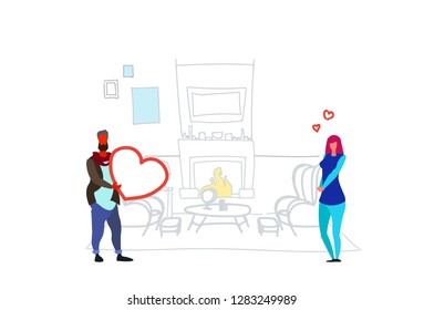 man giving woman heart shape happy valentines day holiday concept couple in love over decorated fireplace home interior sketch doodle horizontal