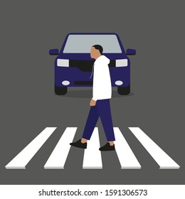 A man goes on a pedestrian crossing in front of a car