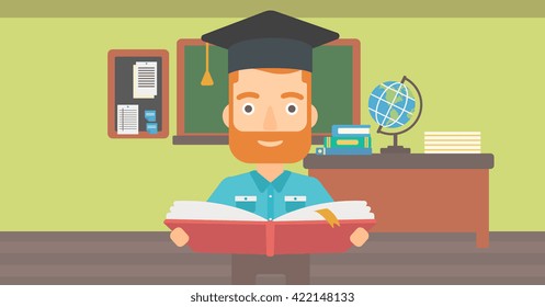 Man in graduation cap holding book.
