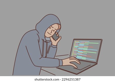 Man hacker with laptop and making phone call is engaged in telecom fraud and scamming money already. Guy hacker in hood commits internet crime by hacking server using social engineering or blackmail