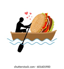  Man and hamburger ride in boat. Guy and Burger. Lovers of sailing.  