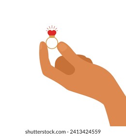 Man hand hold a golden ring with a heart shaped gemstone. Elegance and romantic proposal concept. Shiny ring as symbol of love and commitment.