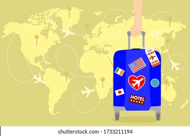 man hand is holding a blue Travel bag with sticker on the yellow world map and has airplane. Vacation time around the world. Enjoy international trip . Tourism, Journey concept. 