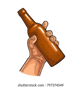 Man hand holding open beer bottle. Vintage vector color engraving illustration for web, poster, invitation to party. Isolated on white background.