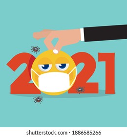 Man Hand Picks Up The Yellow Emoji Wearing a Medical Mask.
Because 2021 is The Year That the Corona Virus Spread Around The World. Vector Illustration.