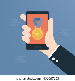 Man hands using a phone showing medal