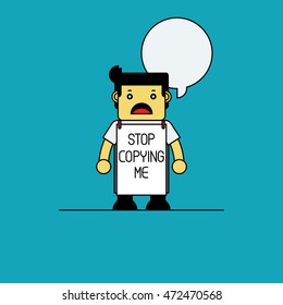 Man hanging Stop Copying me sign.