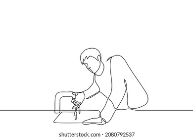 man with hangover wants to stand by the sink through his hand the water flows from the tap - one line drawing vector. tired, weakened or sick man washing yourself