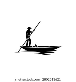 A man in a hat stands in a boat, using a long pole to propel himself through the water.
