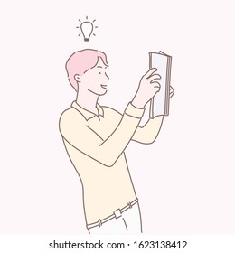 man having a great idea while reading a book.Hand drawn style vector design illustrations.