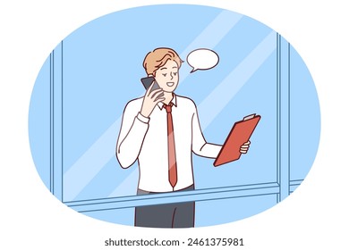 Man head of corporation is talking on phone negotiating with partners, view from behind window skyscraper. Successful guy manager or businessman holding telephone presentation to potential employees