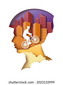 Man head in cyclist helmet silhouette with city buildings and bicycle rider inside, vector illustration in paper art style. City eco transport poster.