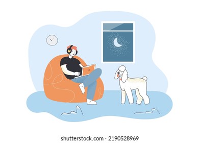 Man in headphones sitting with laptop in bean bag chair. Person and dog spending evening time at home flat vector illustration. Gadget, music concept for banner, website design or landing web page