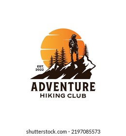 a man hiking mountain peak logo with sunset background. adventure hikers logo design template