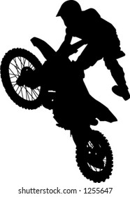 man hitting jump on dirt bike