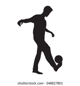 man holding ball on leg silhouette