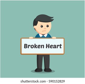 man holding broken heart sign