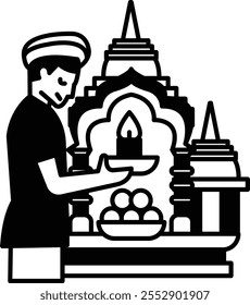 A man is holding a candle in a bowl