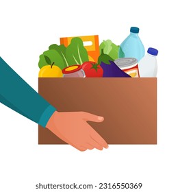 Man holding a cardboard box full of fresh groceries