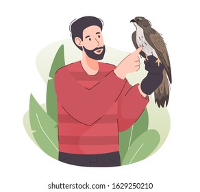 Man holding eagle on his arm. People and pet concept