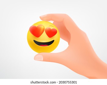 Hombre sosteniendo un emoji en la mano