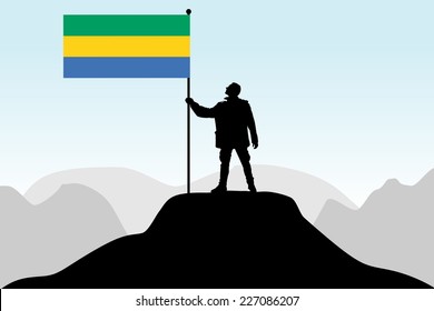 man holding a flag of Gabon, vector 