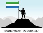 man holding a flag of Sierra Leone, vector 
