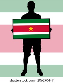man holding a flag of Suriname 