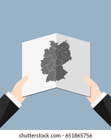 Man Holding a Germany Map 