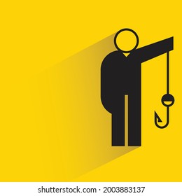 man holding hook shadow on yellow background