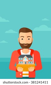 Man holding house model.
