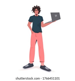 man holding laptop guy model in trendy clothes male cartoon character standing pose full length isolated vector illustration