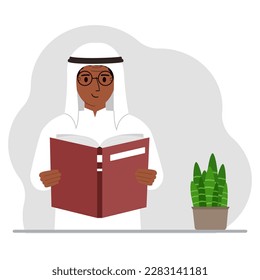 The man is holding a large book in his hands.